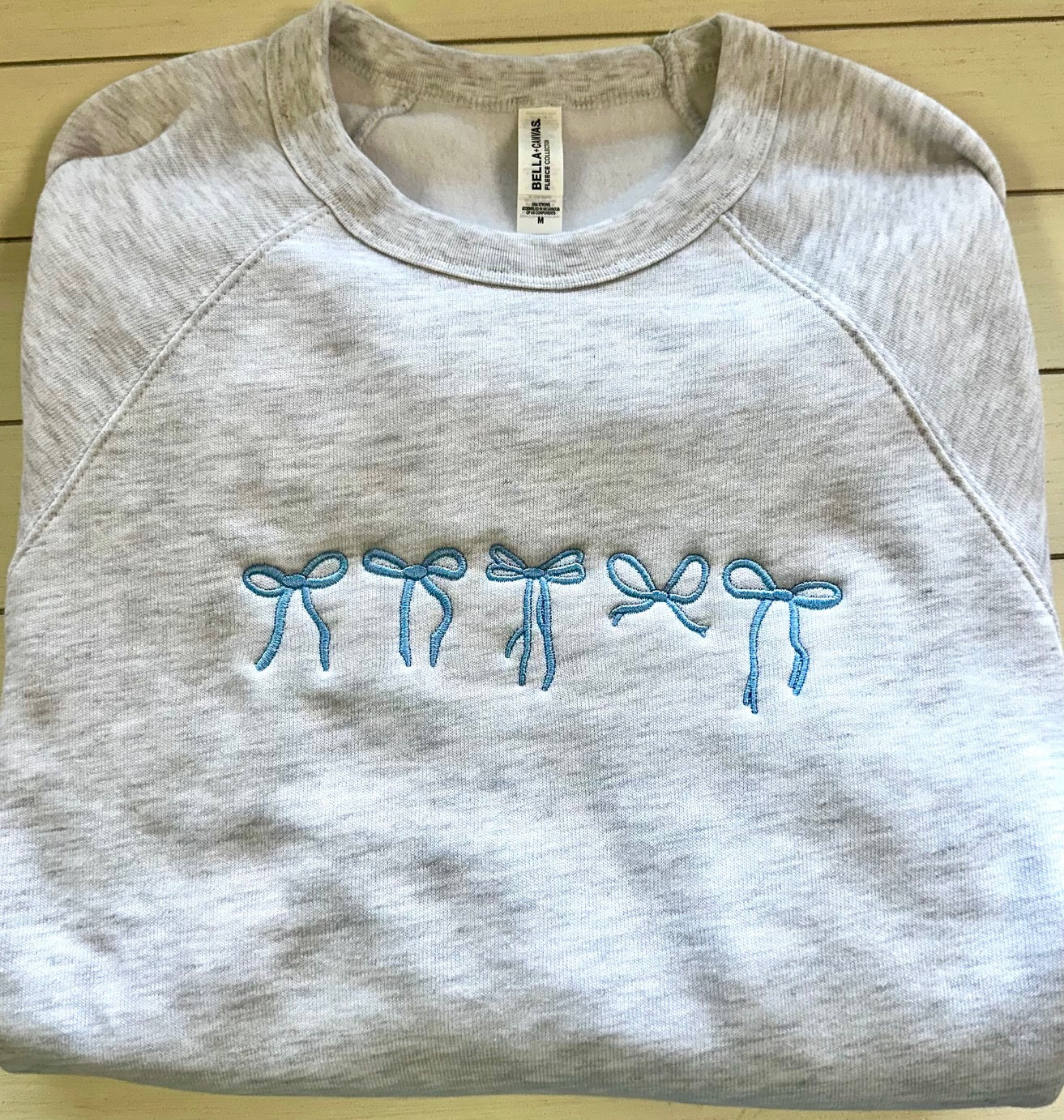 Blue Bow Lineup - Embroidered Sweatshirt